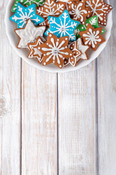 Christmas Gingerbread Cookies Stars on wooden table.