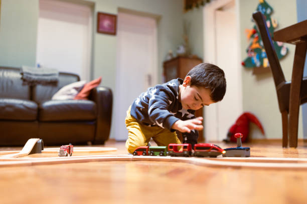 istock Playful Child with Toy Trains at Home 2186872805