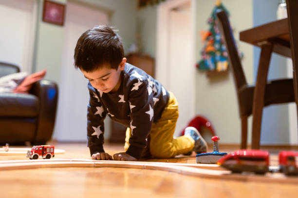 istock Child Playing with Toy Car at Home 2186872806