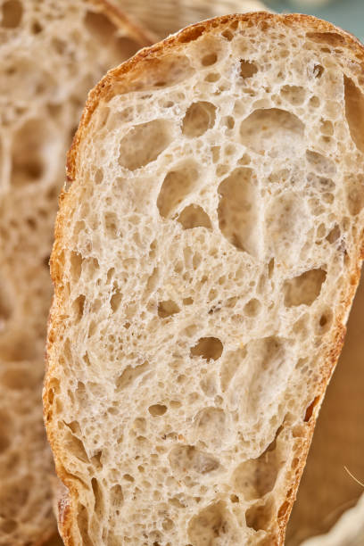 istock Close-up of an artisan bread slice highlighting its airy texture 2186875676