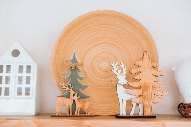 istock Decorative wooden animals and trees on display with rustic plate backdrop 2186876801