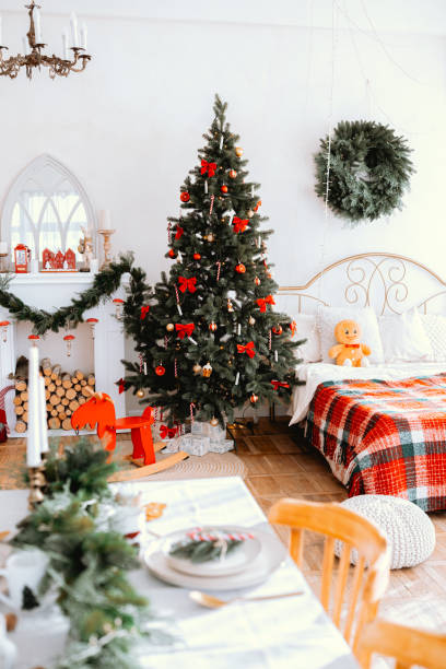 istock Cozy Christmas living room with a decorated tree and festive decor 2186876978