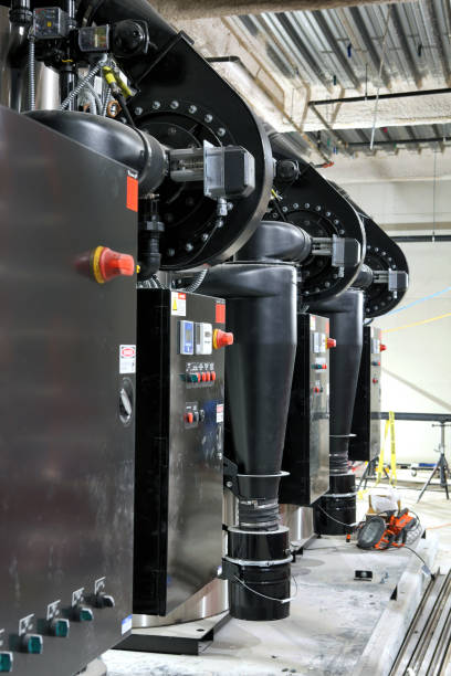 istock A row of steam boilers and blower fans in a heating system. 2186877792
