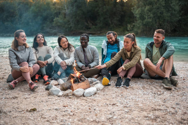 istock Multiracial Friends Gathered Around Outdoors Bonfire 2186878261