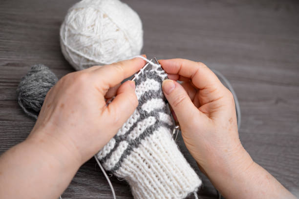 istock female hands knitting close up 2186881584