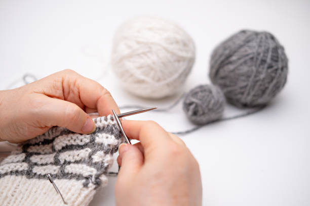 istock female hands knitting close up 2186881591