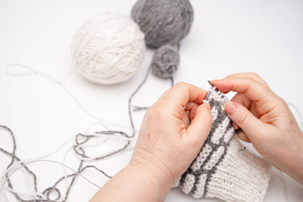istock female hands knitting close up 2186881595