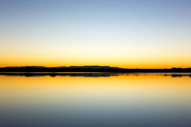 Bosque del Apache Wildlife Refuge: Sunrise Over Pond/Lake