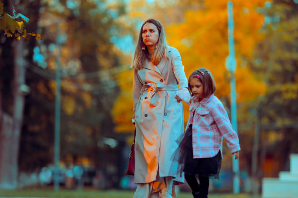 istock Tired Mom Being Dragged on by her Happy Daughter 2186885025