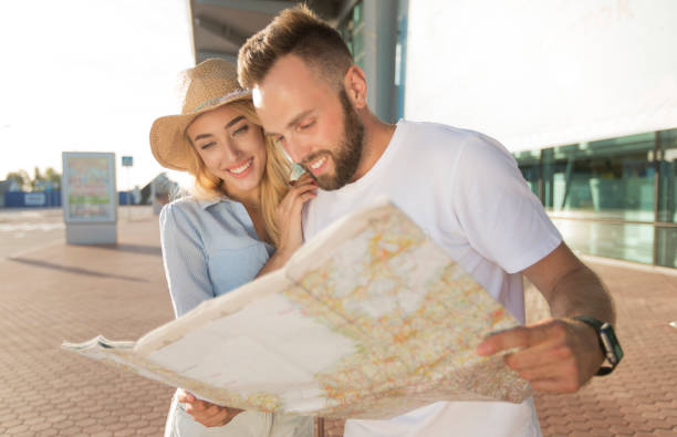 istock Tourists looking at the map choosing destinations 2186887834