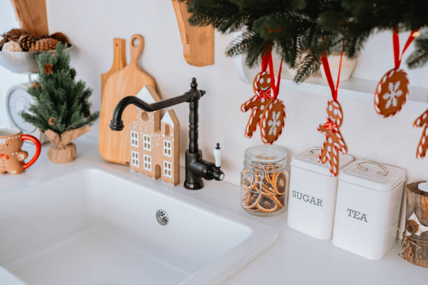 istock Cozy kitchen decorated for the holidays with gingerbread cookies and greenery 2186890997