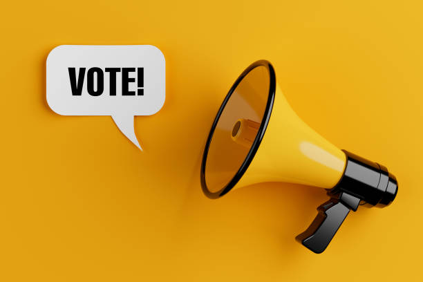 istock Yellow Megaphone with Vote Sign Speech Clouds Chat Bubble. 3d Rendering 2186891851