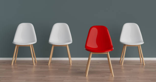 istock Success Concept. Row of White Office Chairs with One Red Moving Forward. 3d Rendering 2186892011