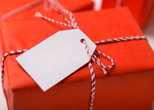 istock Close up of Christmas present box with white label 2186893530