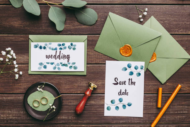 istock Wedding postcards or invitations, wedding rings and green envelopes 2186894499
