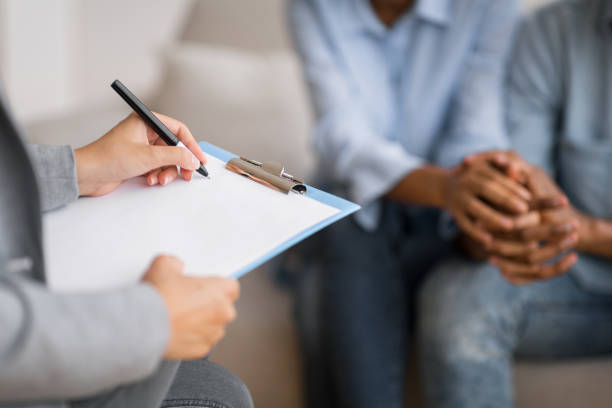 istock African American Spouses Holding Hands Visiting Marital Therapist 2186894655