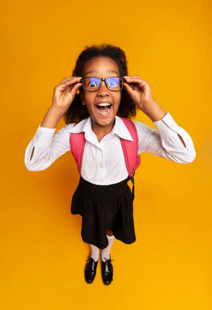 istock Black Schoolgirl Screaming Looking At Camera, High-Angle Studio Shot 2186894982