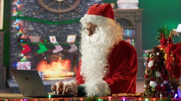 istock Saint Nicholas is busy online browsing Christmas websites in his cabin 2186896245