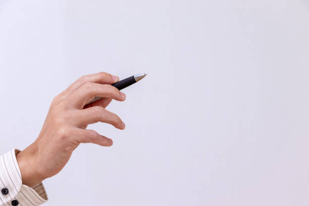 istock Male hand holding a pen 2186896756
