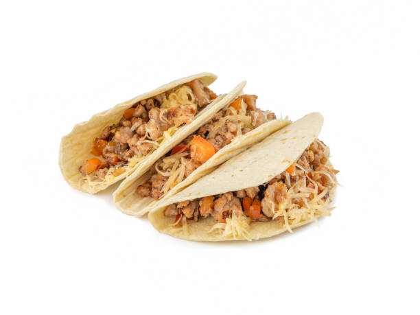 istock Tacos with fried pork, hot peppers, cheese and fresh vegetables. Close-up. Isolate. White background. 2186898062