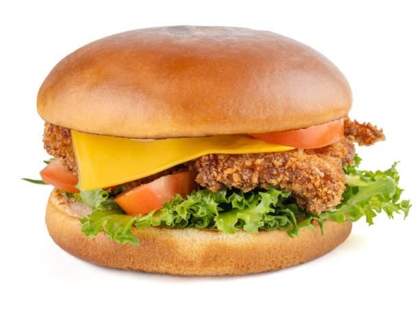 istock Hamburger with chicken strips, fresh vegetables and cheddar cheese. Brioche bun. Close-up. Isolate. White background. 2186898094