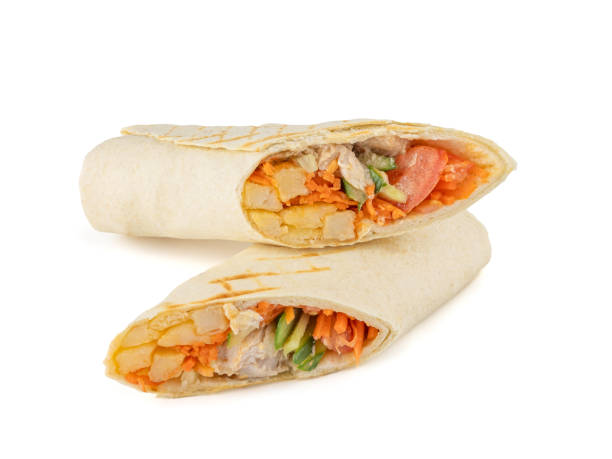 istock Burrito with chicken and vegetables cut in half. Isolate. White background 2186898104