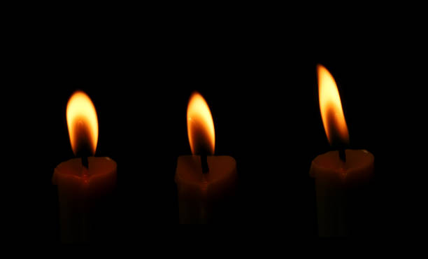 Candlelight and flame Black illustration lights with dark background at night, bright celebration, a funeral with death in a cemetery.