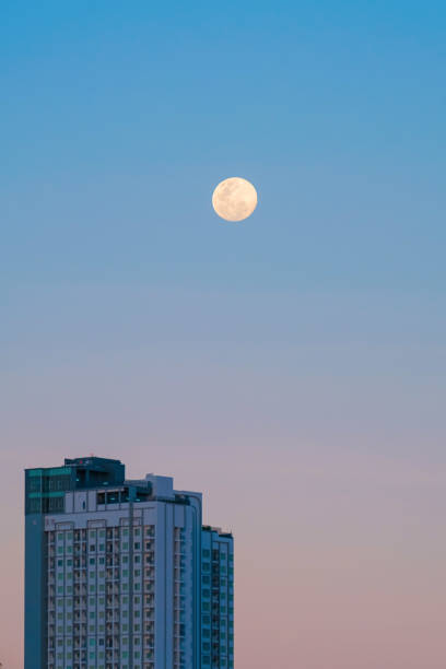 istock Tall buildings next to the moon 2186901661