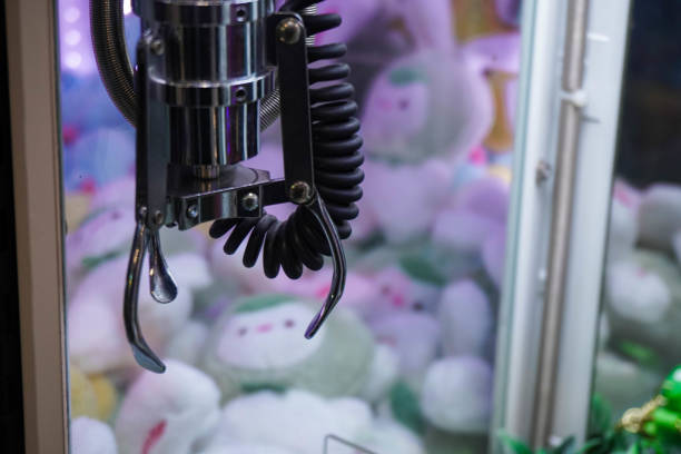 istock Doll picker or Claw clamp machine in game arcade. 2186902492
