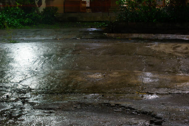 istock view of wet ground after rain at night 2186902948