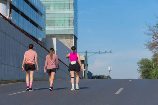 istock Three women walking on a city road after exercising 2186905830