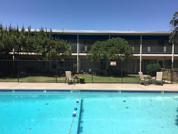 istock outdoor swimming pool with chairs 2186906750