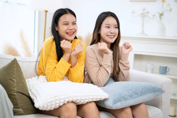 istock Two happy friends watching movie. 2186908637