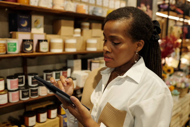 istock African American Woman Using Tablet in Store 2186911864