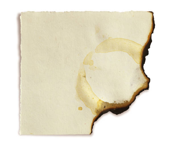 istock Cut out of blank empty plain off white cream colored burnt, old, stained, messy dirty torn ruined, run down, damaged paper sheet with copy space isolated over white horizontal  background 2186912363