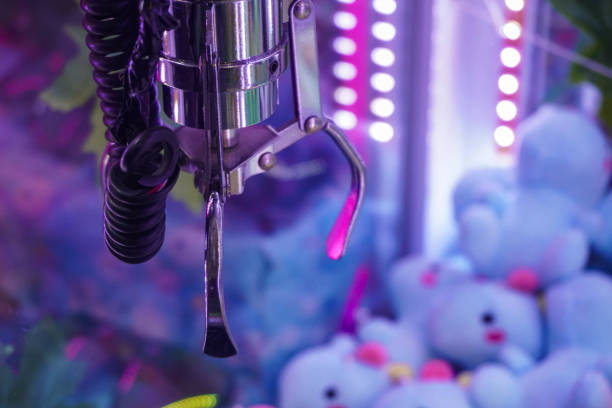 istock Doll picker or Claw clamp machine in game arcade. 2186913978