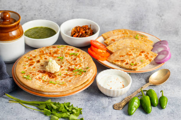 istock Gobi paratha is a stuffed Indian flatbread filled with spiced cauliflower, cooked on a griddle, often served with yogurt or pickles. 2186914297
