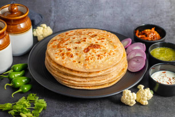 istock Gobi paratha is a traditional Indian flatbread stuffed with spiced mashed cauliflower, served hot with yogurt, pickles, or curry. Delicious and filling. 2186915171