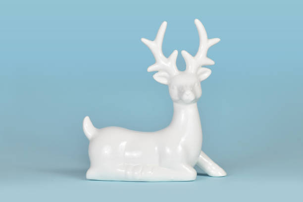 istock White ceramic Christmas or winter decoration deer figurine 2186915675