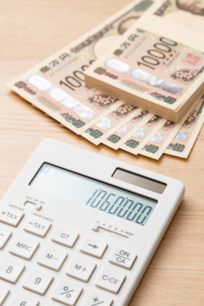 istock 1.06 million yen and a calculator on a table 2186917231