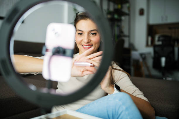 Beauty influencer making content for her audience at home.