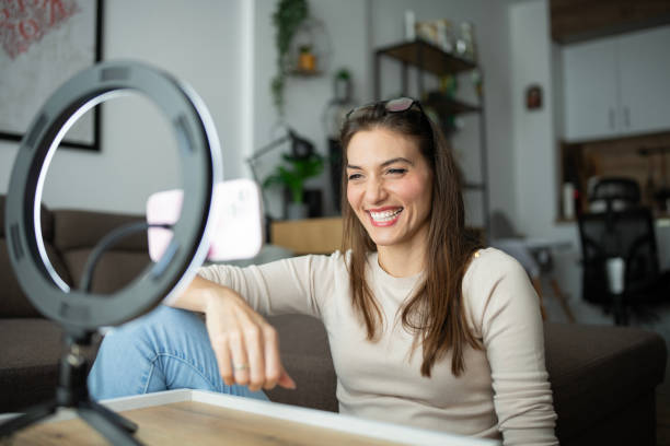 istock Smiling female influencer doing a vlog post at home. 2186920311