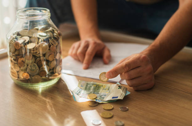 istock Using saving money from piggy bank. 2186920327