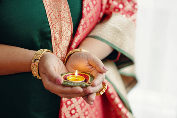 istock Holding Traditional Diya During Festive Celebration 2186920737
