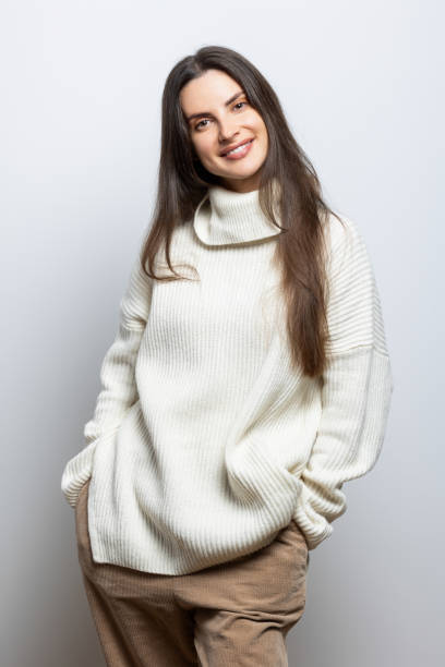 istock Fashion brunette standing and looking at the camera 2186920898