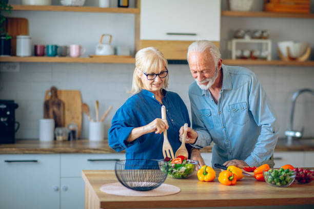 istock Senior couple preparing food in the kitchen 2186923013