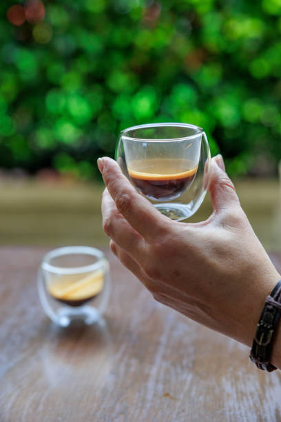 istock Holding a glass cup of espresso 2186923145