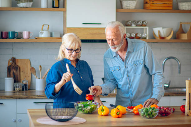 istock Senior couple preparing food in the kitchen 2186923290
