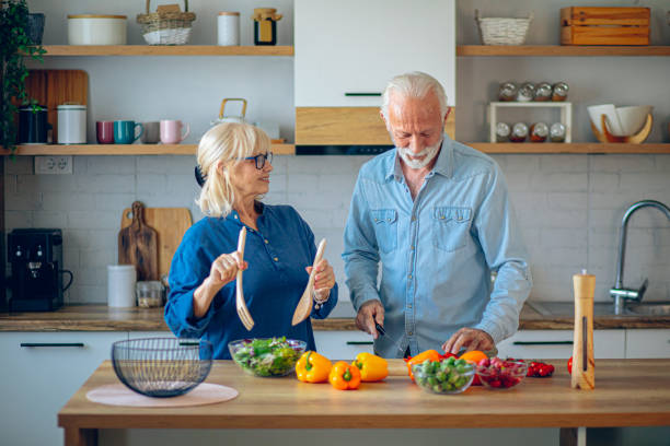 istock Senior couple preparing food in the kitchen 2186923389