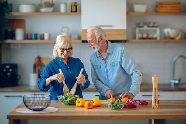 istock Senior couple preparing food in the kitchen 2186923489
